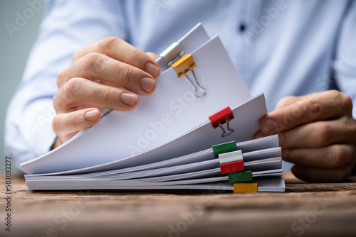 Clerk With Stacked Tax Files photo