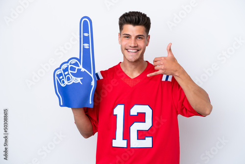 Young caucasian sports fan man isolated on white background making phone gesture. Call me back sign