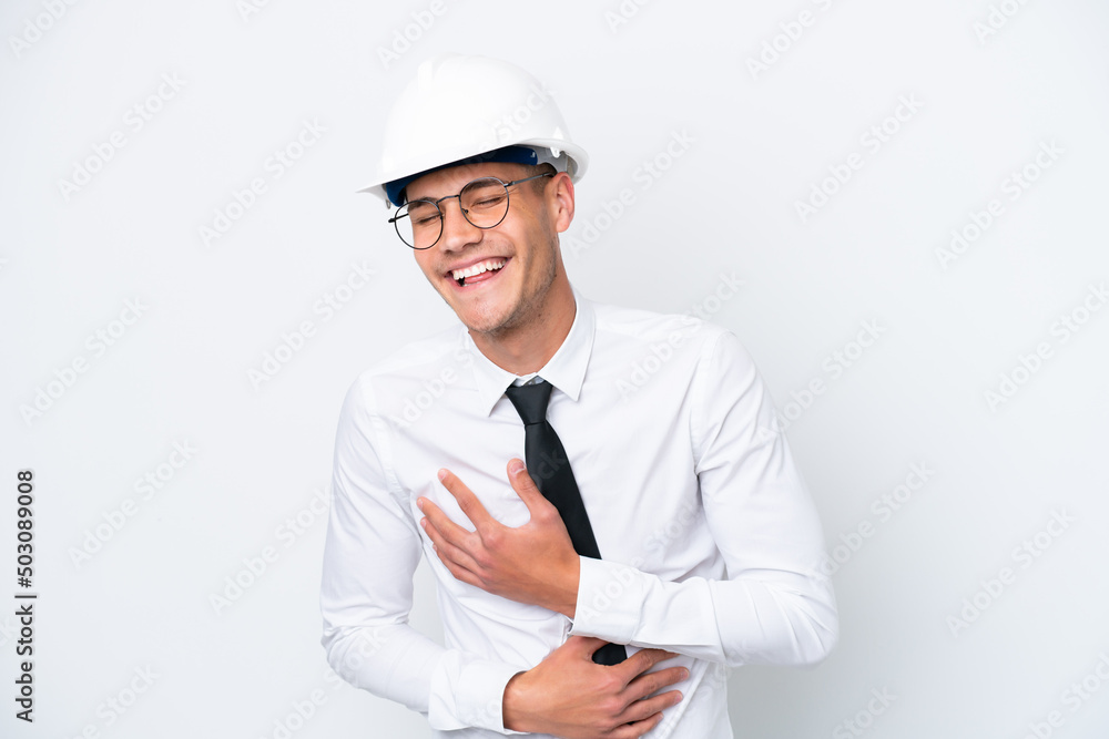 Young architect caucasian man with helmet and holding blueprints isolated on white background smiling a lot Young architect caucasian man with helmet and holding blueprints isolated on white background smiling a lot