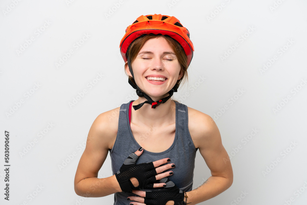 Young cyclist English woman isolated on white background smiling a lot Young cyclist English woman isolated on white background smiling a lot