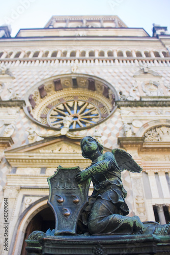 Bronze angel statue in front of Cappella Colleoni in Bergamo