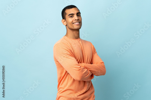 African American man over isolated background with arms crossed and looking forward