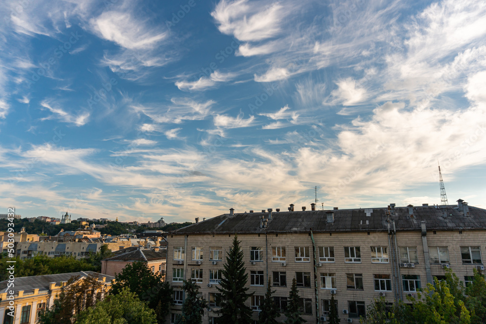 Kyiv, Ukraine – June 26, 2020: Unusual beautiful gentle little white clouds in the city, blue sky