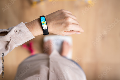 Weight Scale With Smart Watch App. Woman Standing