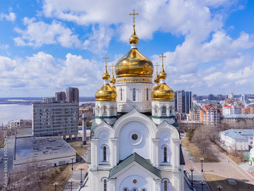 Golden domes of the Christian cathedral. The Transfiguration Cathedral is an Orthodox cathedral in Khabarovsk. The tallest building in the city. 