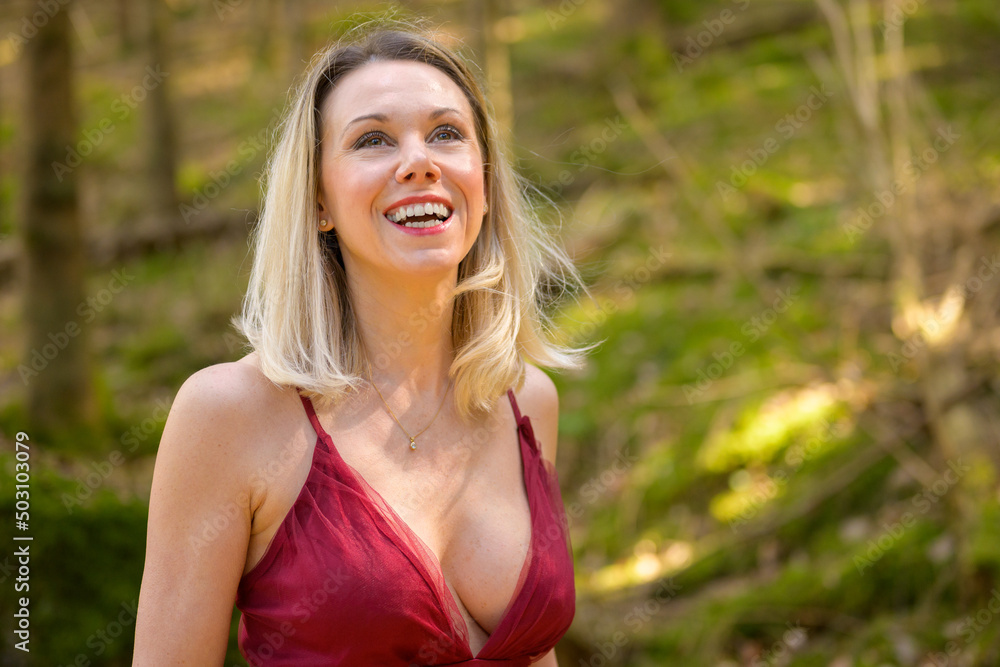Happy sensual woman wearing magenta dress. Happy sensual woman wearing magenta dress.