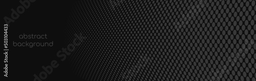 Gray dots on a black background. Halftone pattern. Vector banner, header.
