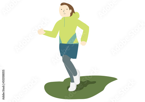 緑の上をランニングする女性