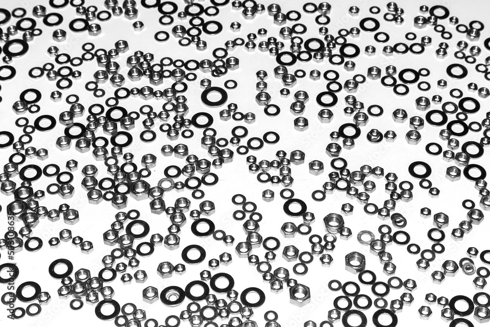Nuts and washers on a white background close-up. Nuts and washers on a white background close-up.