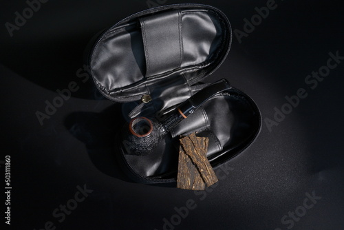 classic bent apple pipe in leather pouch with tabaco