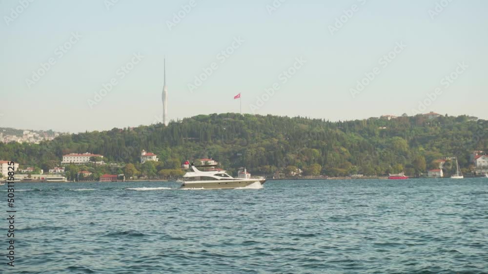 Speedboat is crossing the Bosporus in Istanbul, Turkey Speedboat is crossing the Bosporus in Istanbul, Turkey