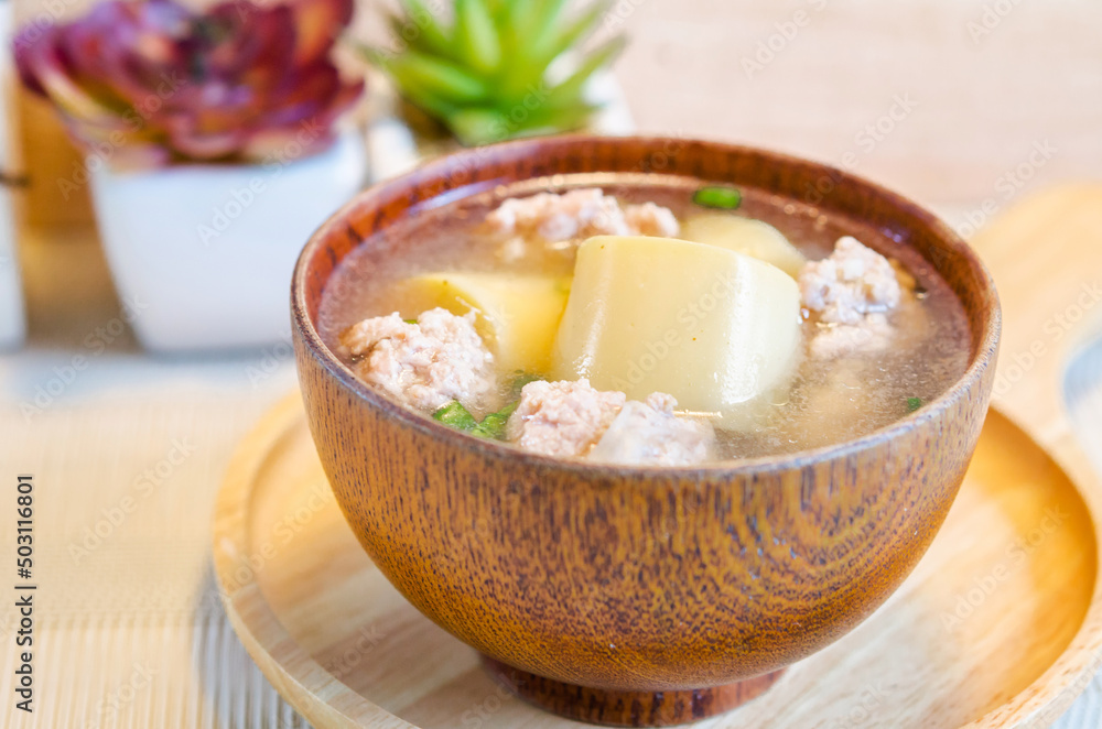 Minced pork and soya bean curd soup in wooden bowl. Minced pork and soya bean curd soup in wooden bowl.