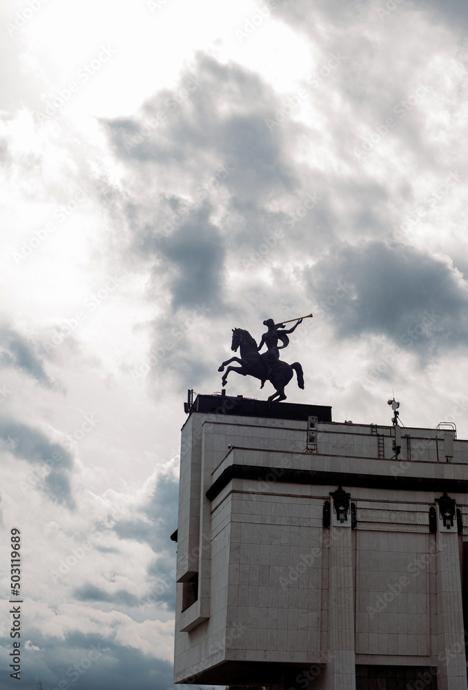 art, monument, sculpture, on the top of the building and sky with clouds