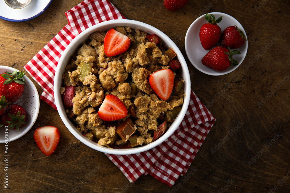 Homemade rhubarb crumble with strawberry Homemade rhubarb crumble with strawberry