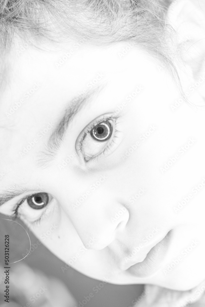 Fototapeta premium Isolated close up portrait of a young and beautiful Caucasian girl 