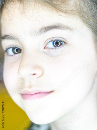 Isolated close up portrait of a young and beautiful Caucasian girl 
