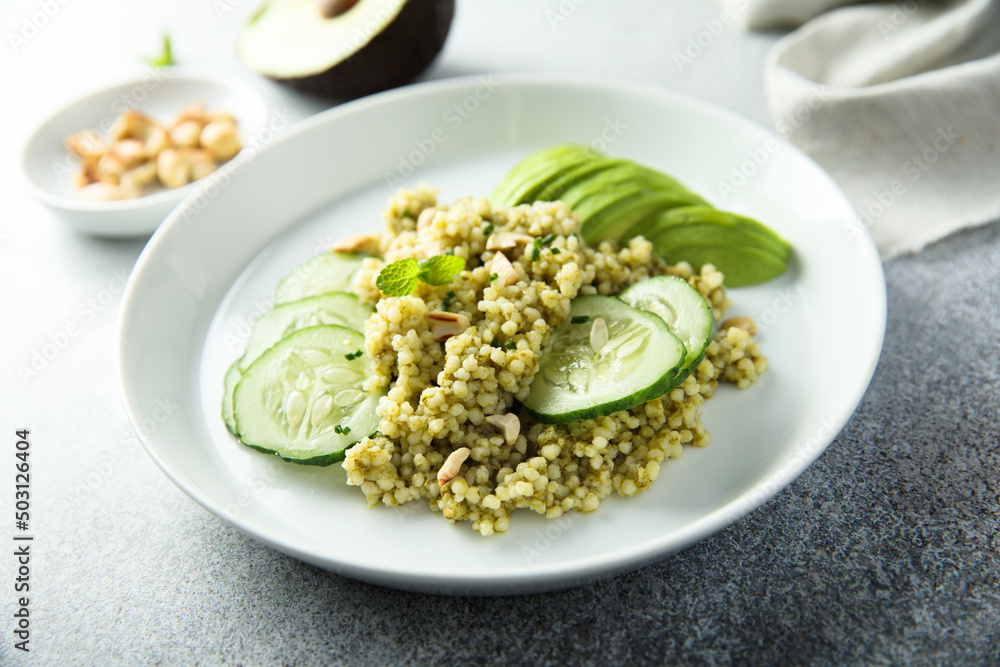 Couscous with pesto, cucumber and avocado