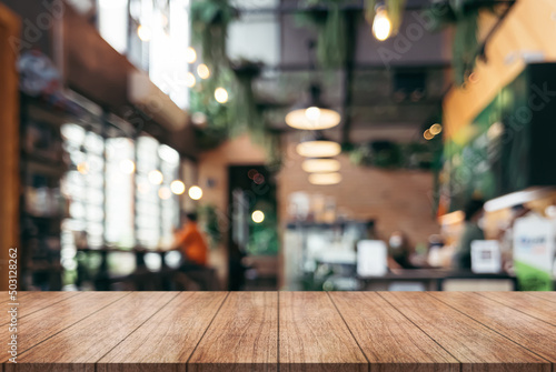 Wallpaper Mural Empty wooden table top with lights bokeh on blur restaurant background. Torontodigital.ca