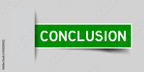 Inserted green color label sticker with word conclusion on gray background