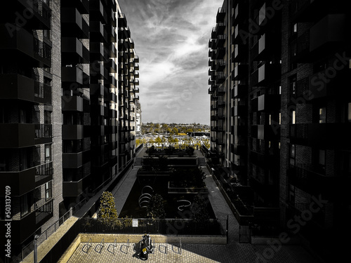 between to buildings with a parked up moterbike