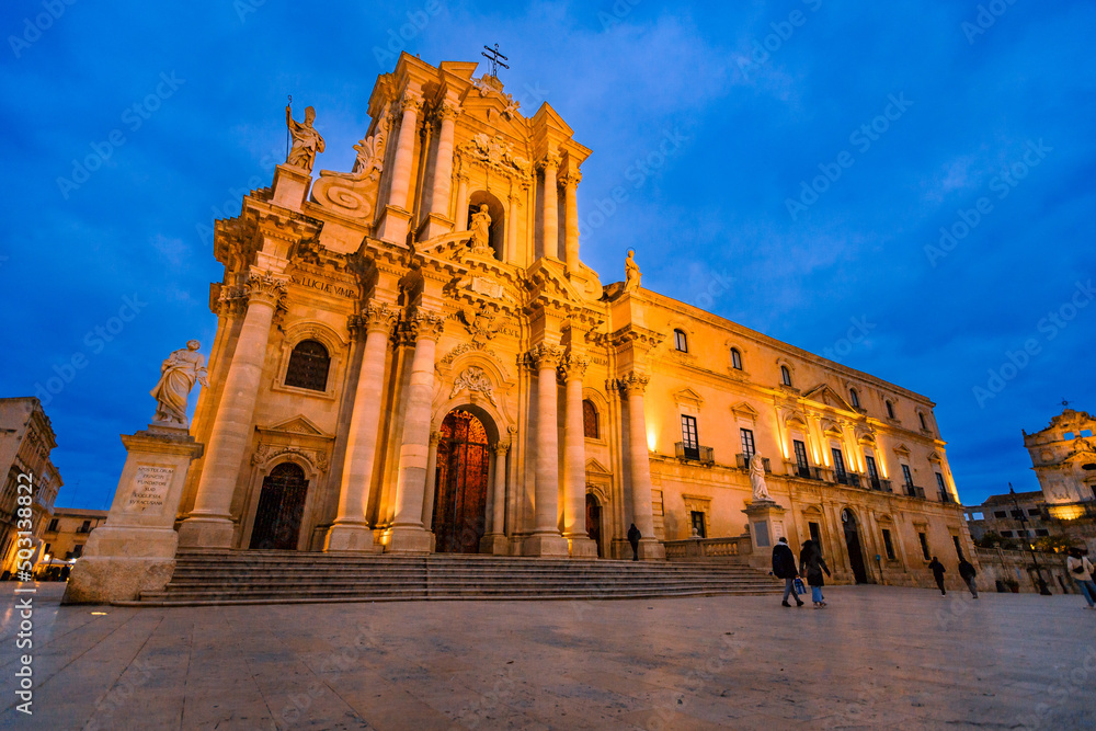 Cathedral of Syracuse in Ortigia at sunset with people