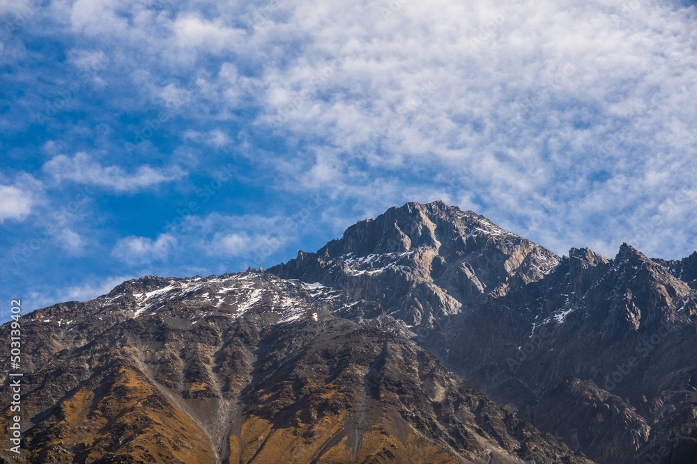 Mountain ridge against blue sky Mountain ridge against blue sky