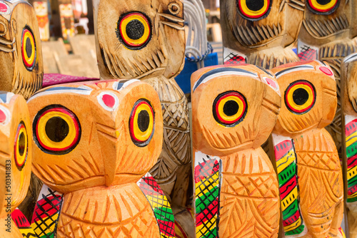 Wooden owls, artworks of handicraft, on display during Handicraft Fair in Kolkata - the biggest handicrafts fair in Asia. photo