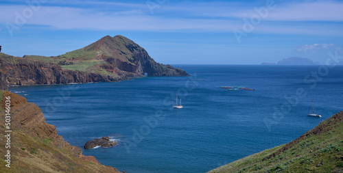 Ponta de San Lorenzo, the easternmost point of the Madeira Island and a nature reserve. The island in the North Atlantic Ocean. Yachts at the foreground and the Desertas Islands at the background.