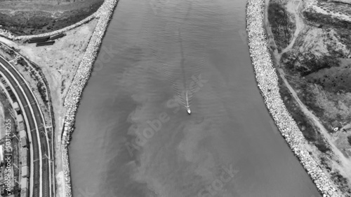 Aerial view of a little boat in the cenger of the river, Tuscany, Italy photo