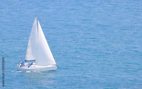 Beautiful sailing yacht on blue ocean 