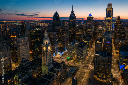 Billede på lærred Aerial Drone View of Philadelphia Skyline at Sunset with Glowing City Lights wit