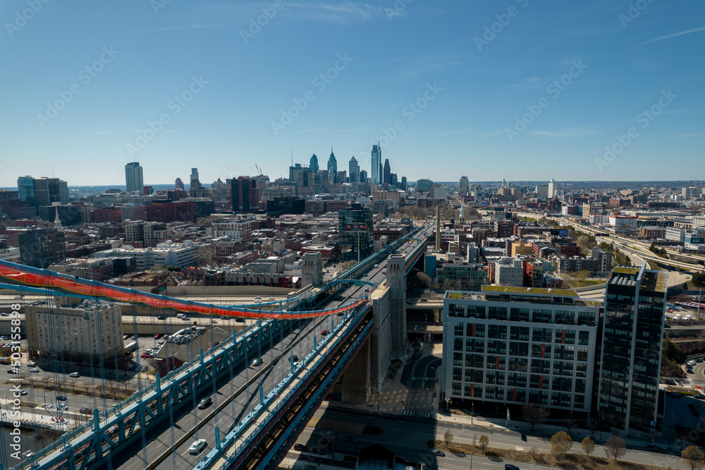 Aerial Drone View of Philadelphia on a Clear Sunny Day with Bridge Over a River in Foreground