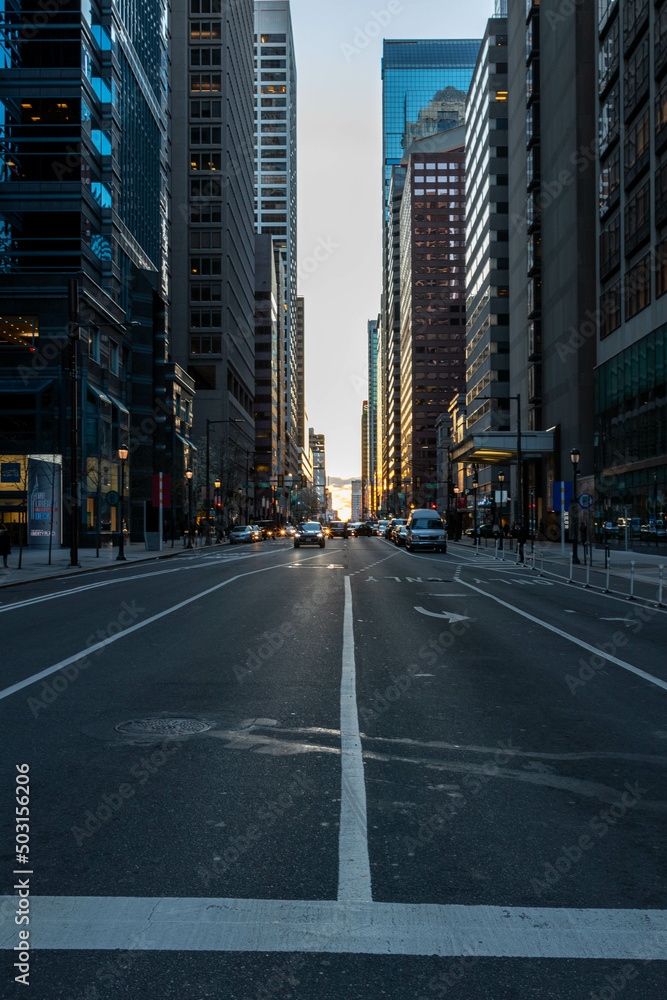 Cars Driving at Sunset by Buildings in Philadelphia Cars Driving at Sunset by Buildings in Philadelphia