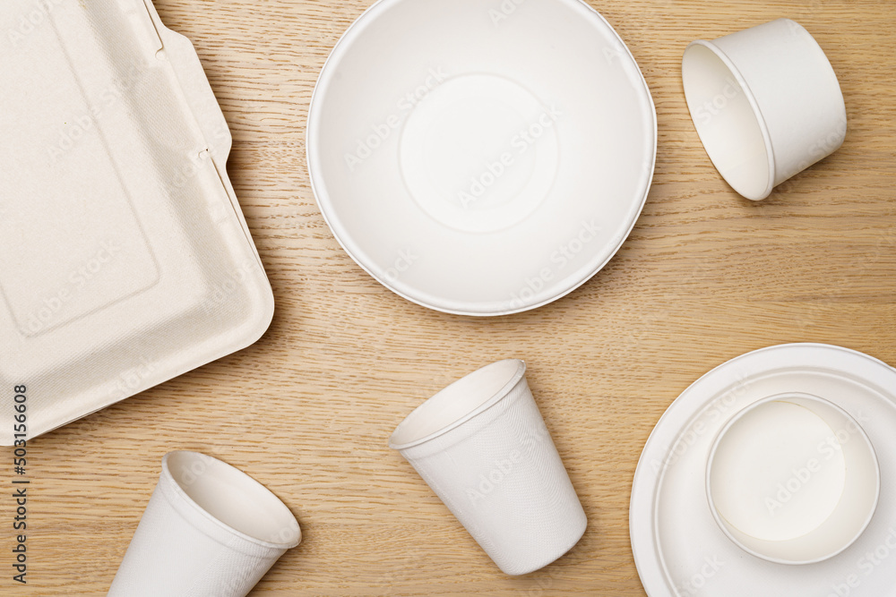 Eco friendly concept, Food container set and paper cup of biodegradable on wooden background Eco friendly concept, Food container set and paper cup of biodegradable on wooden background