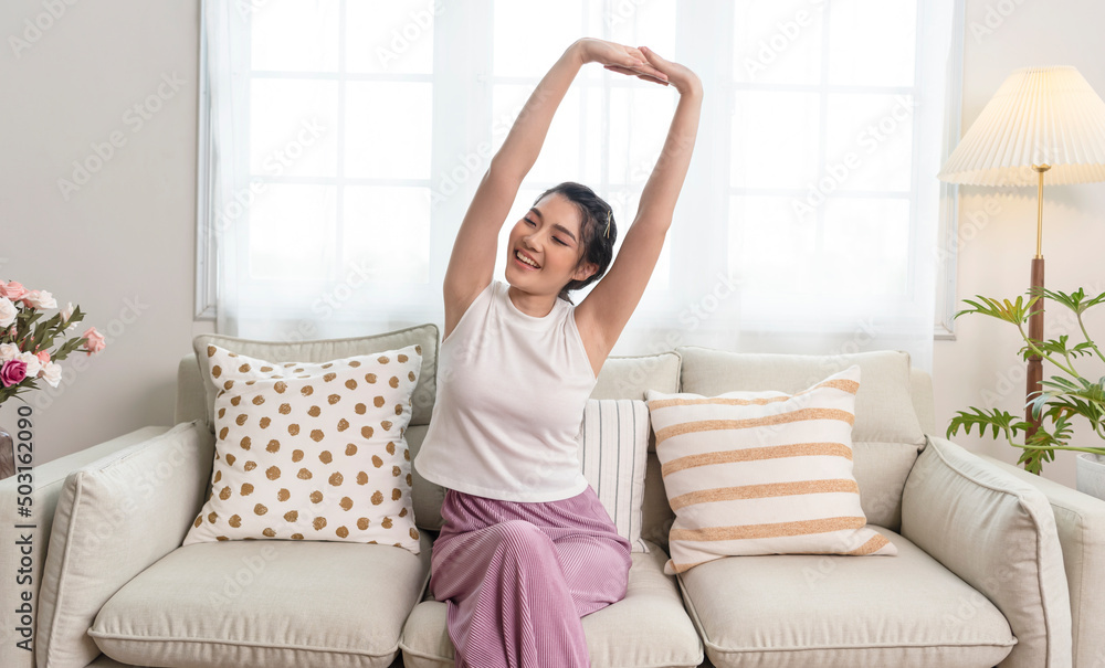 Home lifestyle asian woman relaxing on sofa in living room. Home lifestyle asian woman relaxing on sofa in living room.