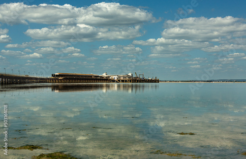 Reflections: clouds and pier at low tide © Therese Elaine