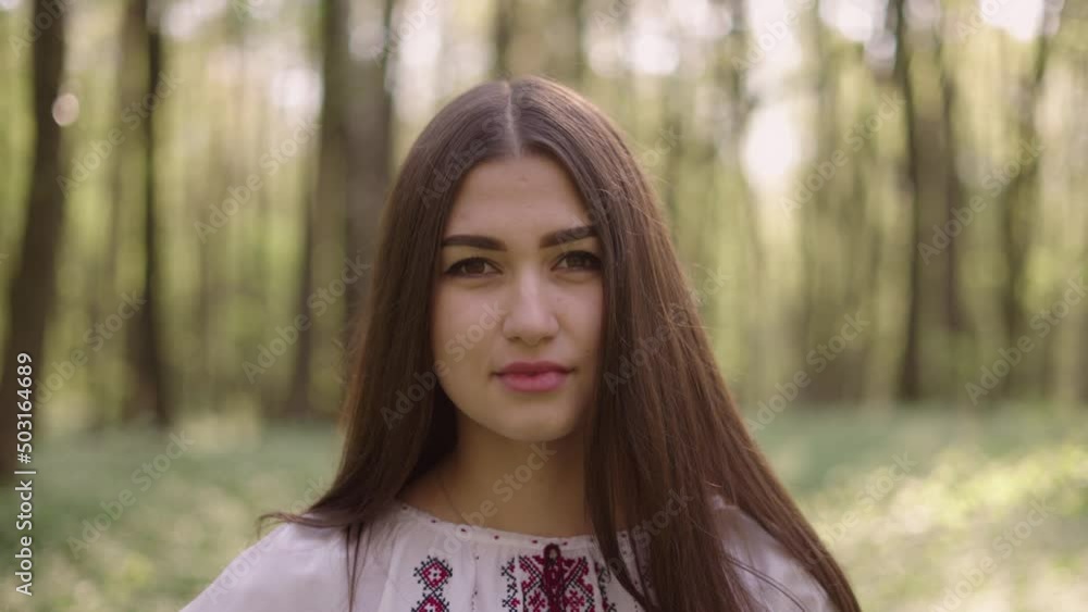 close up 4k shot of young beautiful Ukrainian woman in vyshyvanka - ukrainian national clothes. Stand with Ukraine close up 4k shot of young beautiful Ukrainian woman in vyshyvanka - ukrainian national clothes. Stand with Ukraine