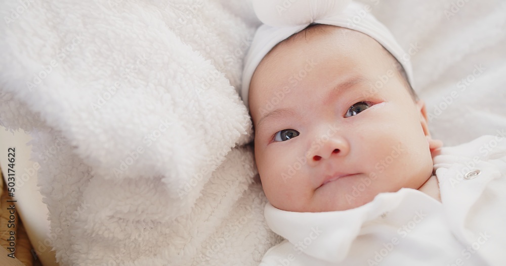 cute adorable Asian baby infant girl lying on comfortable bed and looking at camera
cute adorable Asian baby infant girl lying on comfortable bed and looking at camera