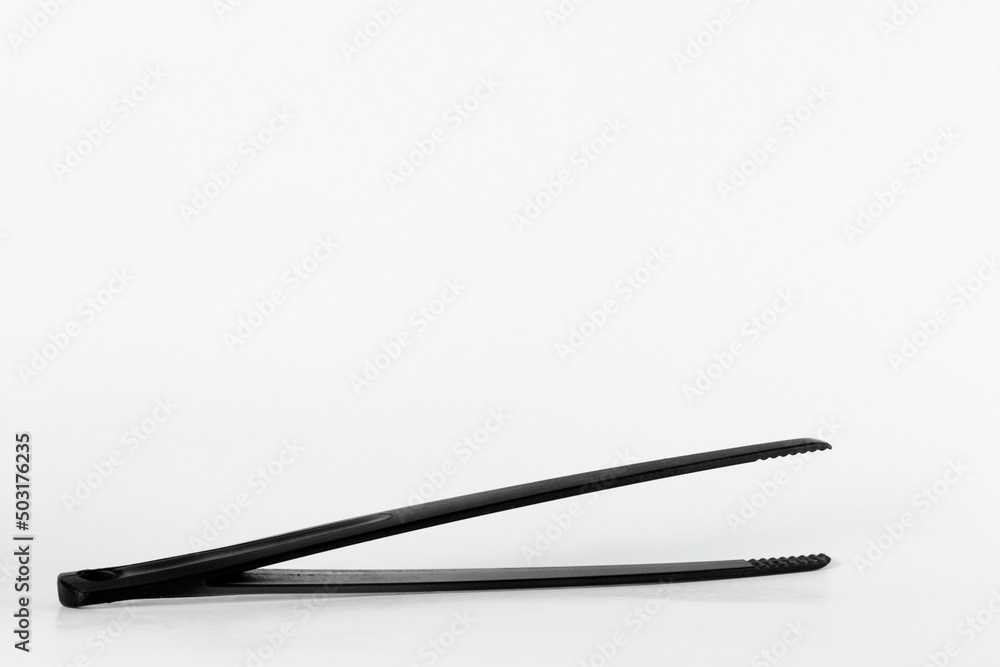 Black tweezer tongs for cooking and serving food Black tweezer tongs for cooking and serving food