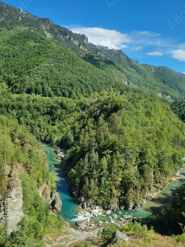 Picturesque canyon of the Tara river.Mountains surrounding the canyon.Forests on the slopes of the mountains.Haze over the mountains.  View from the Djurdzhevich Bridge Montenegro photo