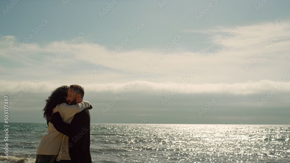 Joyful couple have fun together on vacation sea beach. Young people love nature Joyful couple have fun together on vacation sea beach. Young people love nature