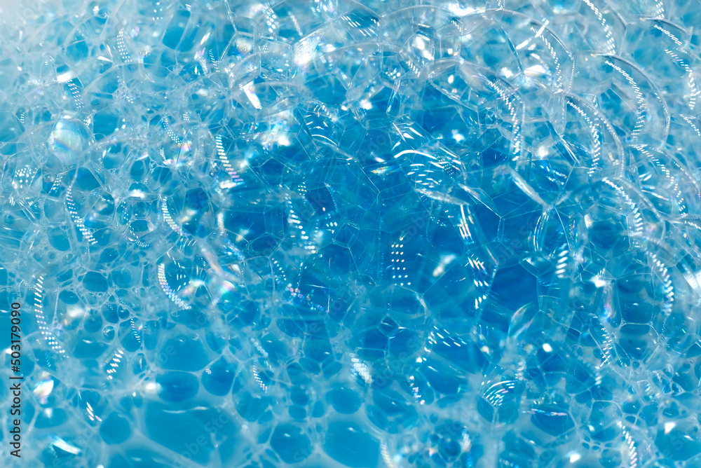 Soap foam. Background of dusty foam with bubbles of blue color for an inscription. Soap sud with copy-space Soap foam. Background of dusty foam with bubbles of blue color for an inscription. Soap sud with copy-space