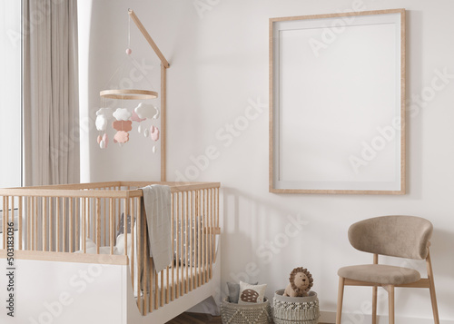 Empty vertical picture frame on white wall in modern child room. Mock up interior in scandinavian style. Free, copy space for your picture. Baby bed, chair. Cozy room for kids. 3D rendering. photo