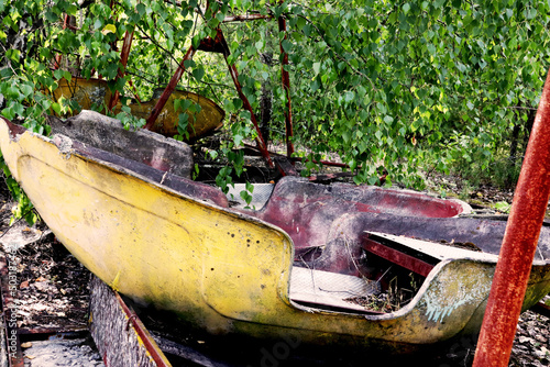 Boat swings of chernobyl / Prypyat amusement parkt in ukraine photo