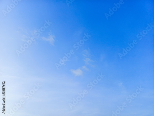 Blue sky with transparent clouds background