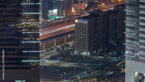 Busy Sheikh Zayed Road traffic aerial night timelapse in Dubai city  United Arab Emirates