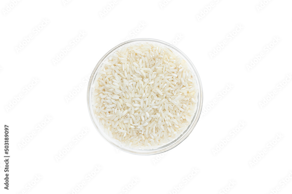 Rice groats in a glass bowl isolated on white background, top view. Healthy food. Rice groats in a glass bowl isolated on white background, top view. Healthy food.