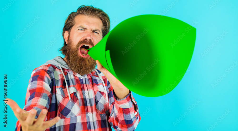 Man shouts in loudspeaker. Bearded guy yelling in bullhorn. Hipster with megaphone. Discount, sale. Man shouts in loudspeaker. Bearded guy yelling in bullhorn. Hipster with megaphone. Discount, sale.