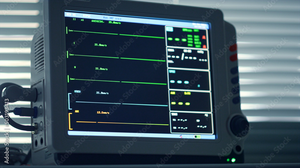 Closeup heart rate monitor device showing no vital signs in intensive care room. Closeup heart rate monitor device showing no vital signs in intensive care room.