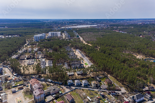 Top view of the destroyed and burnt houses. Houses were destroyed by rockets or mines from Russian soldiers. Cities of Ukraine after the Russian occupation.